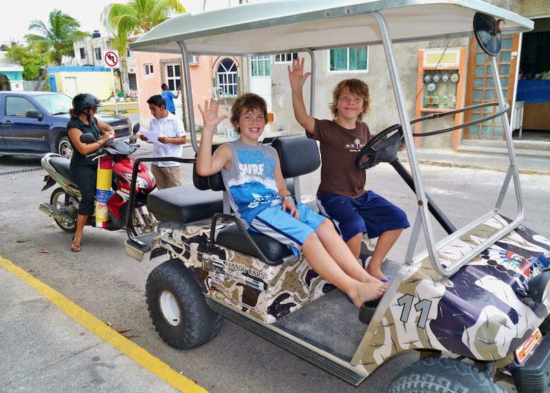 Getting around by golf car in Isla Mujeres.