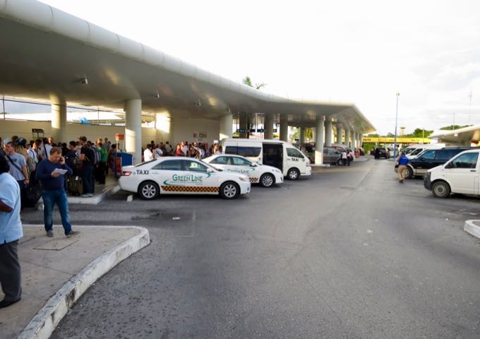 Taxis, shuttle, and transfer pick up area at the Cancun airport.