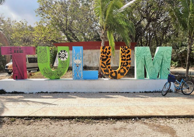 The sign at the entrance to Tulum with a bicycle