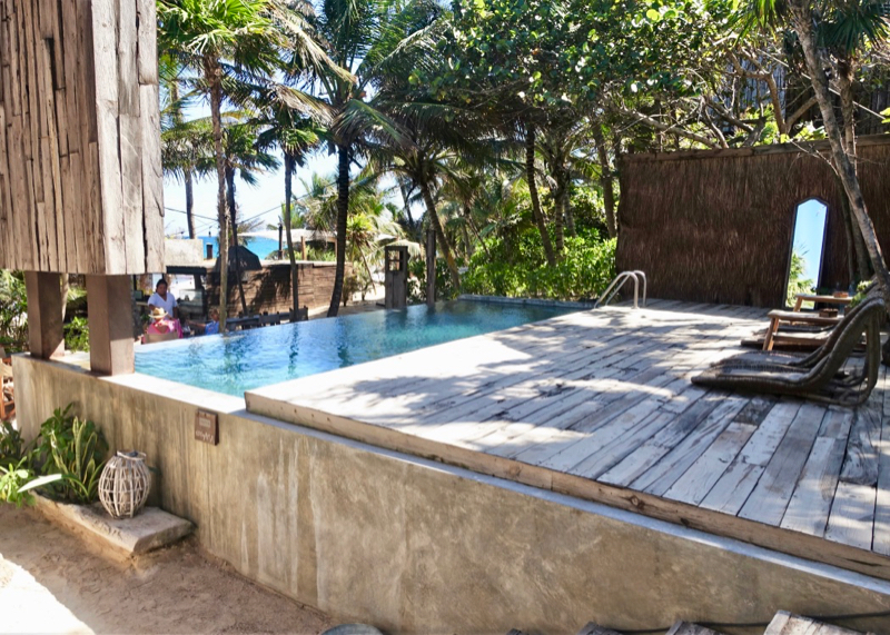 A small pool on the edge of the beachfront.