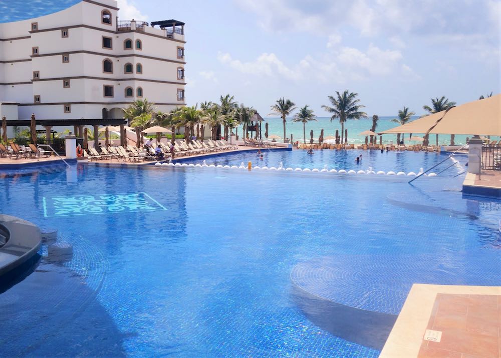 Swim up bar and beach club at Cancun luxury resort.