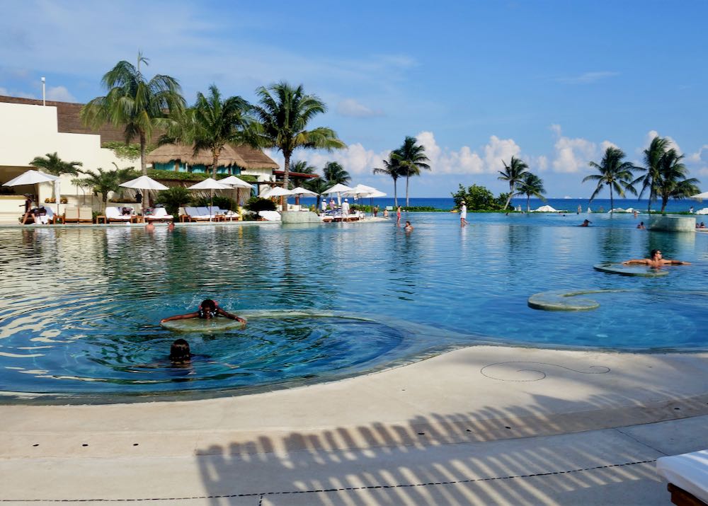 Beach hotel with large outdoor swimming pool in Playa del Carmen, Mexico.