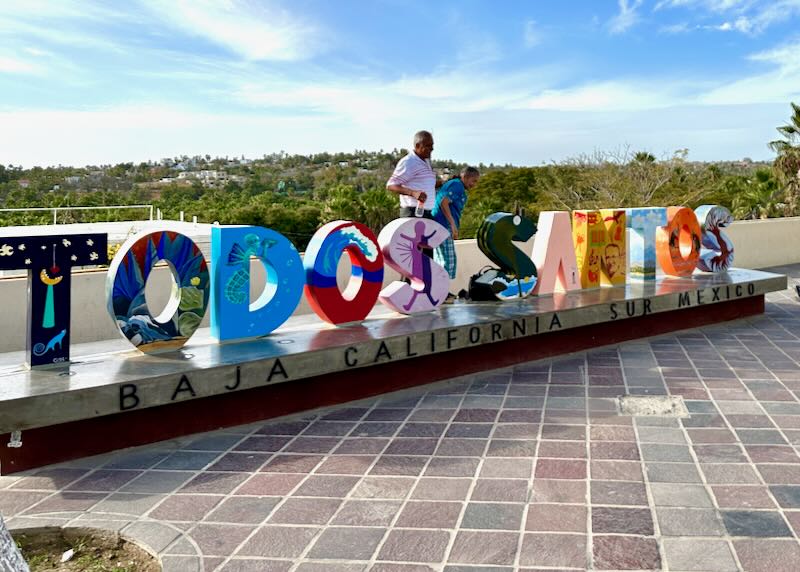 A colorful Todos Santos sign.