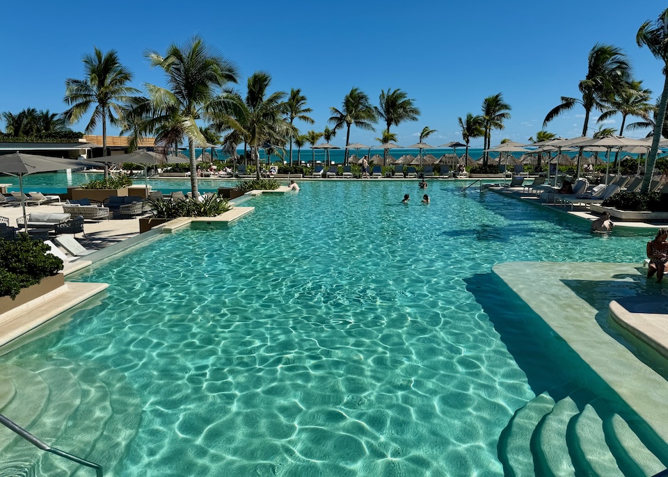 A long view over the pool facing the ocean at Atelier resort in Playa Mujeres near Cancun.