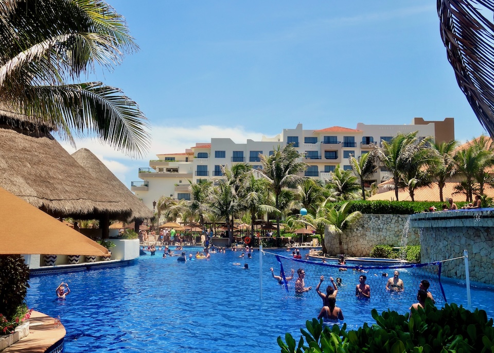 People playing volleyball in the pool at Fiesta Americana Condesa resort in Cancun.