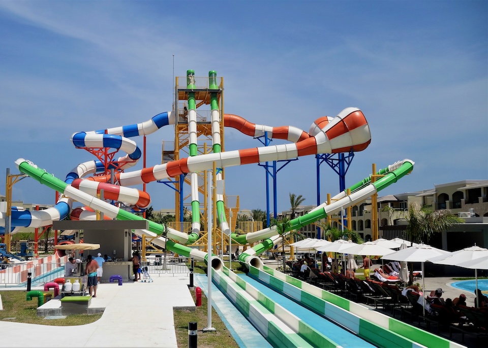 Colorful striped waterslides at Moon Palace the Grand resort in Cancun.