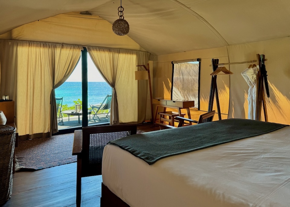 Inside a spacious luxury tent with an ocean view at Our Habitas hotel in of Tulum.