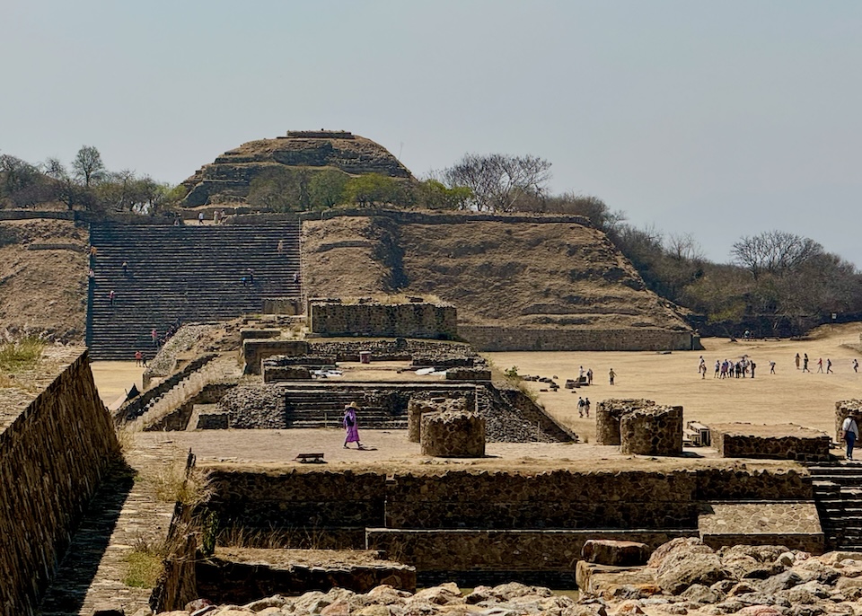 Massive ancient ruins of temples, pyramids, and stairs in Monte Albán outside of Oaxaca.