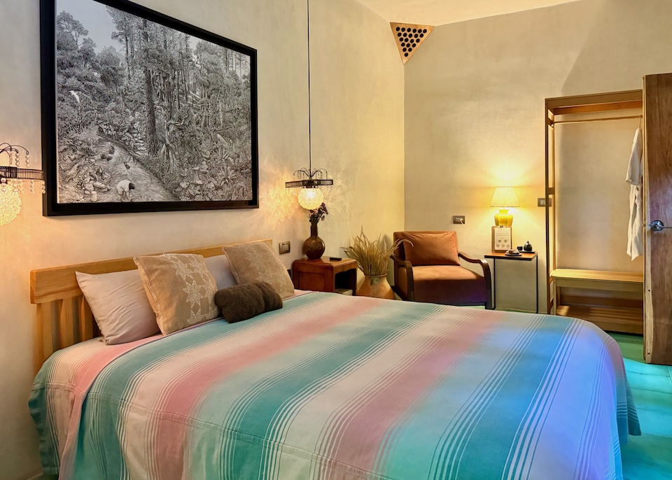 A softly lit room with eclectic, romantic decor at Boulenc Bed and Bread in Oaxaca.