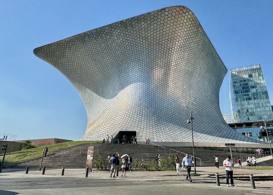 The futuristic, silver exterior of Museum Soumaya in Nuevo Polanco resembles a rectangular prism that's been squeezed in the middle.