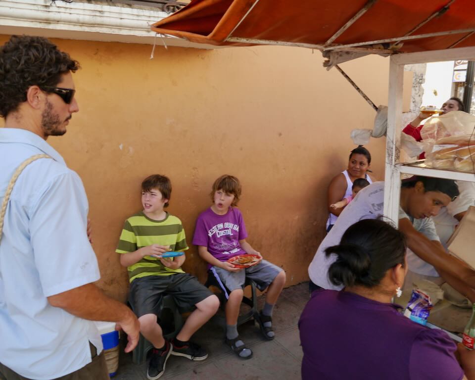 My kids eating street food in the Yucatan, Mexico.